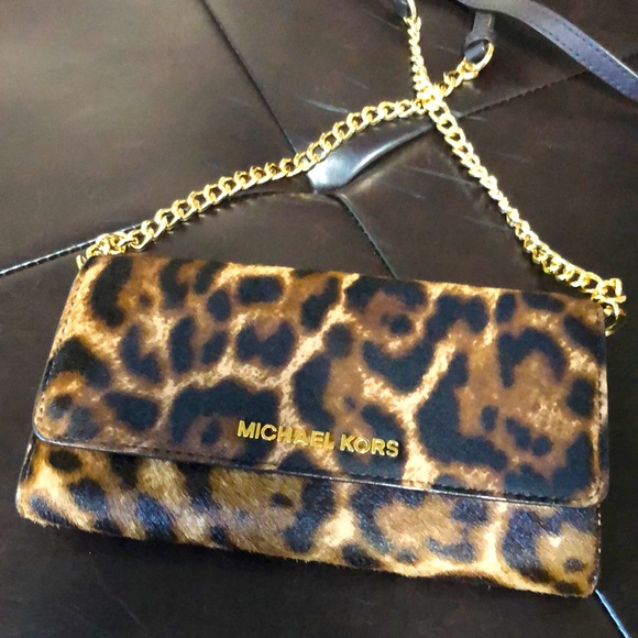 Michael Kors Handbags - Michael Kors GENUINE calf hair and leather crossbody in animal print.
